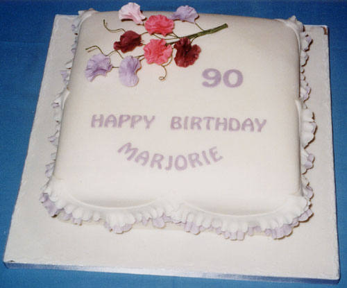 A rich petal-shape 70th birthday fruit cake with a simple design.