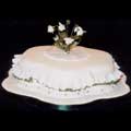 A petal shape rich fruit cake with sugar crafted snowdrops and double frills.